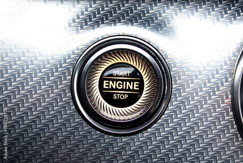 Close-up of a start-stop button on a dashboard in a modern premium luxury car. Engine Start Stop push button, Engine Start and stop modern car button.