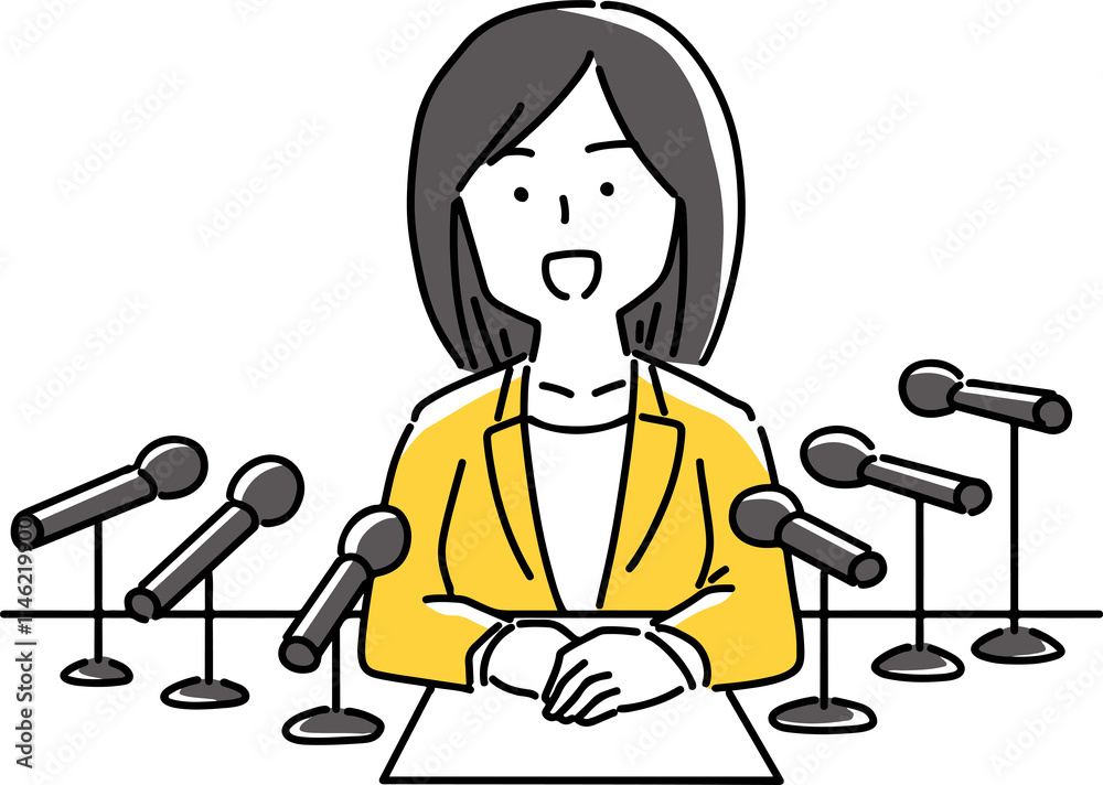 Fototapeta premium 沢山のマイクで囲まれて説明する女性