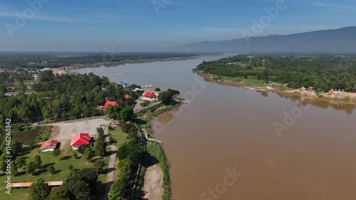 Aerial view of Wat Ahong Silawat temple located nearly Mekong river at Pakxan town, Laos on the border with Thailand, opposite Bueng Kan province of Thailand. photo