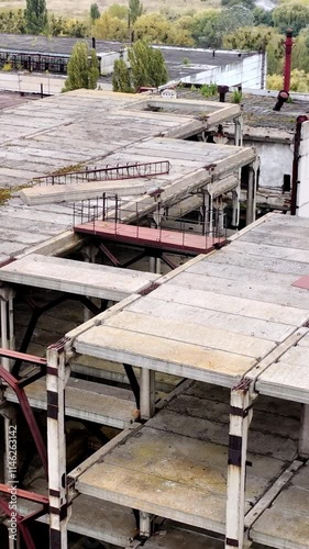 Wallpaper Mural Ruined buildings. Industrial constructions without windows on abandoned plant. Old manufacture. Circling view.. Vertical video Torontodigital.ca