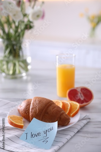 Romantic breakfast with note saying I Love You on table photo