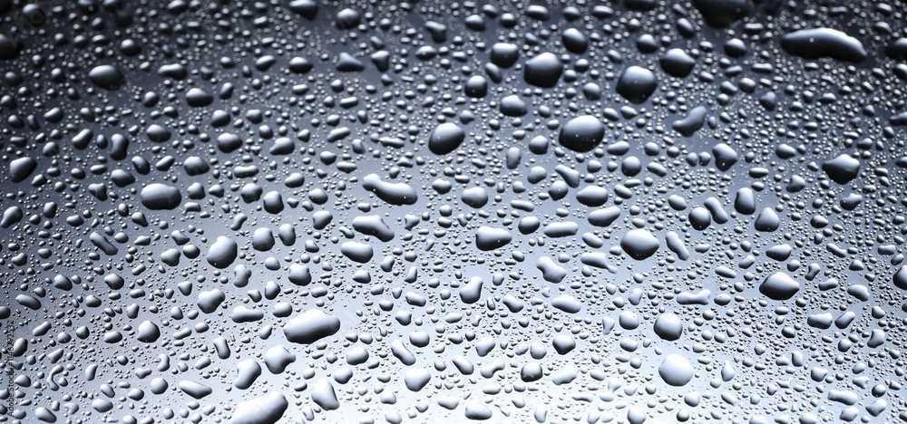 Water drops on glass surface, closeup view Water drops on glass surface, closeup view