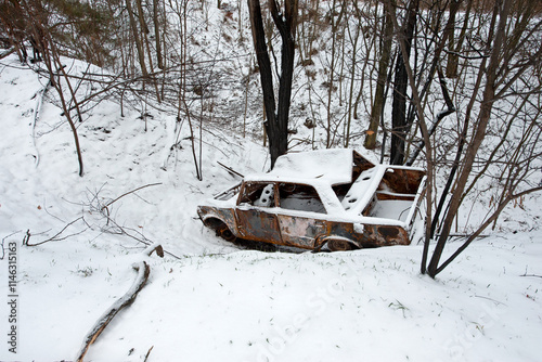 Accident on a winter snowy track. car skidding and falling into a ditch due to ice. Safety and poor driving on the road. auto. broken car, accident in the snow, ditch. the car burned down