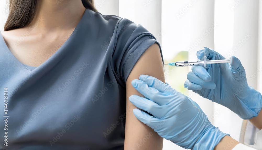 Hand of young woman nurse, doctor giving syringe vaccine, inject shot to arm's patient. Vaccination, immunization or disease prevention against flu or virus Hand of young woman nurse, doctor giving syringe vaccine, inject shot to arm's patient. Vaccination, immunization or disease prevention against flu or virus