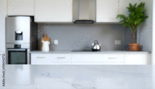 A modern kitchen with a marble countertop, stainless steel appliances, and a blurred background