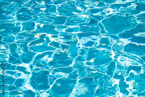Pool water surface. Blue water texture. Close up blue water surface. Sea surface aerial view. Blue swimming poll water surface. Pattern texture.