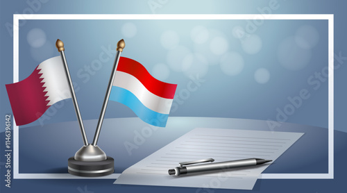 Qatar and Luxembourg National flags on small table with bokeh background, cooperative relationship