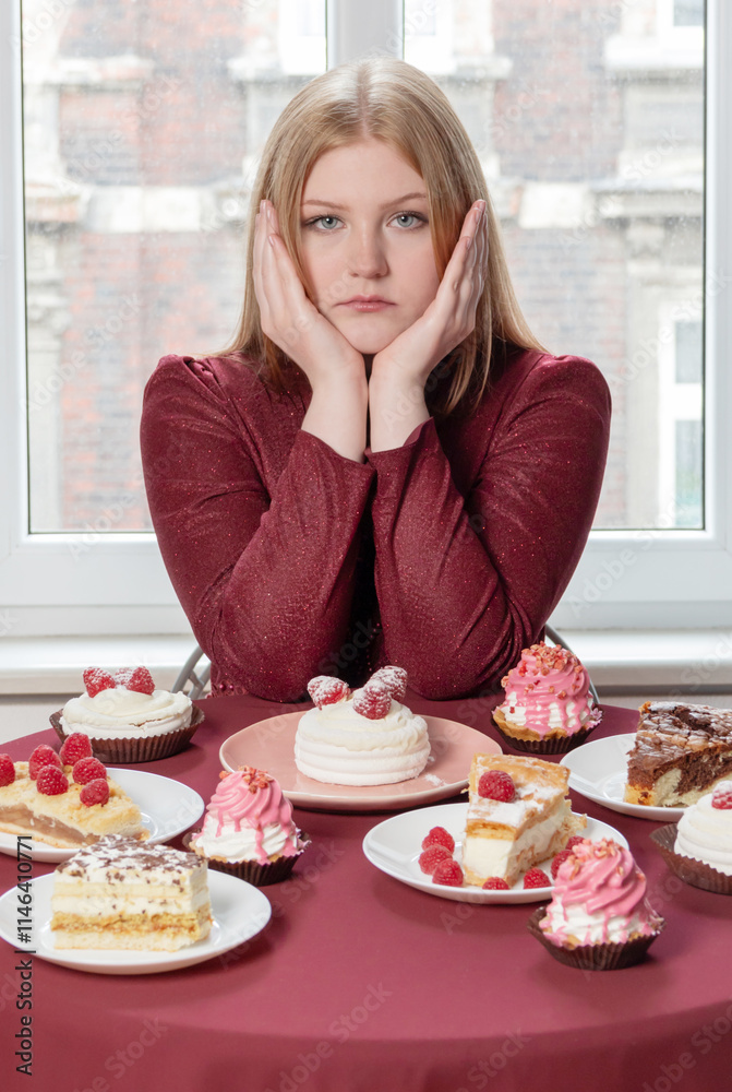 young beautiful woman with desserts indoor young beautiful woman with desserts indoor