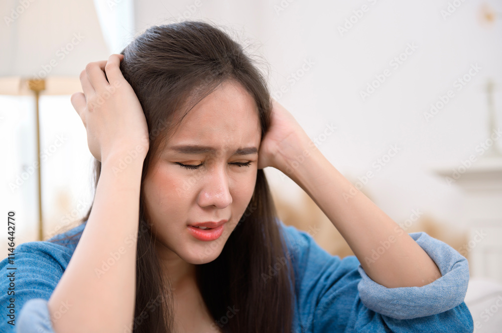 Young asian woman feeling stress in living room at home Young asian woman feeling stress in living room at home