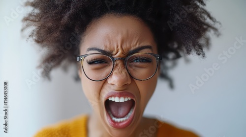 African American woman expressing strong emotions while looking directly at the camera photo