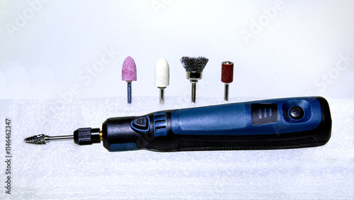 Canvas-taulu Hand-held electric grinder with a burr cutter installed in a collet chuck and four additional attachments
