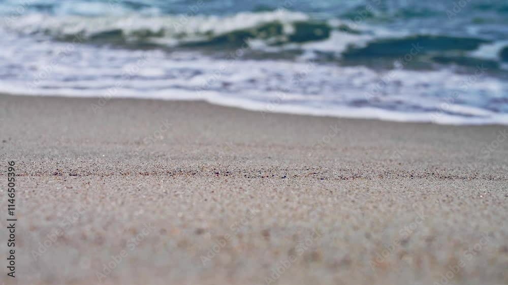 Tranquil waves gently caressing sandy beach shoreline Tranquil waves gently caressing sandy beach shoreline