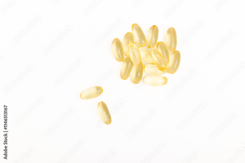 Fototapeta premium Yellow gelatin capsules isolated on white background