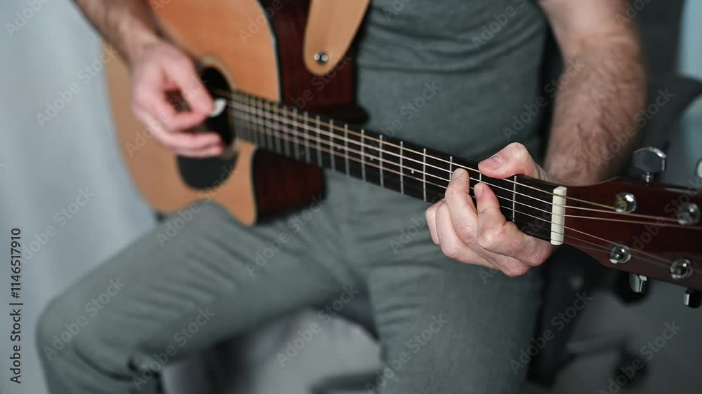 Close up of a musician hands skillfully playing chords on an acoustic guitar, creating beautiful music Close up of a musician hands skillfully playing chords on an acoustic guitar, creating beautiful music