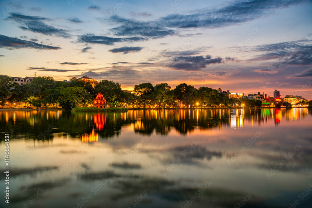 Fototapeta premium Hoan Kiem Lake ( Ho Guom) or Sword lake in the center of Hanoi in cinematic sunset sky.