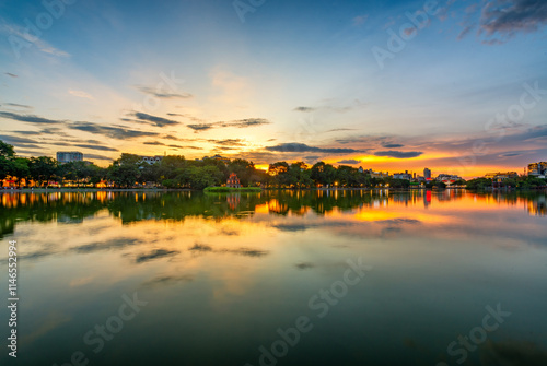 Hoan Kiem Lake ( Ho Guom) or Sword lake in the center of Hanoi in cinematic sunset sky. photo