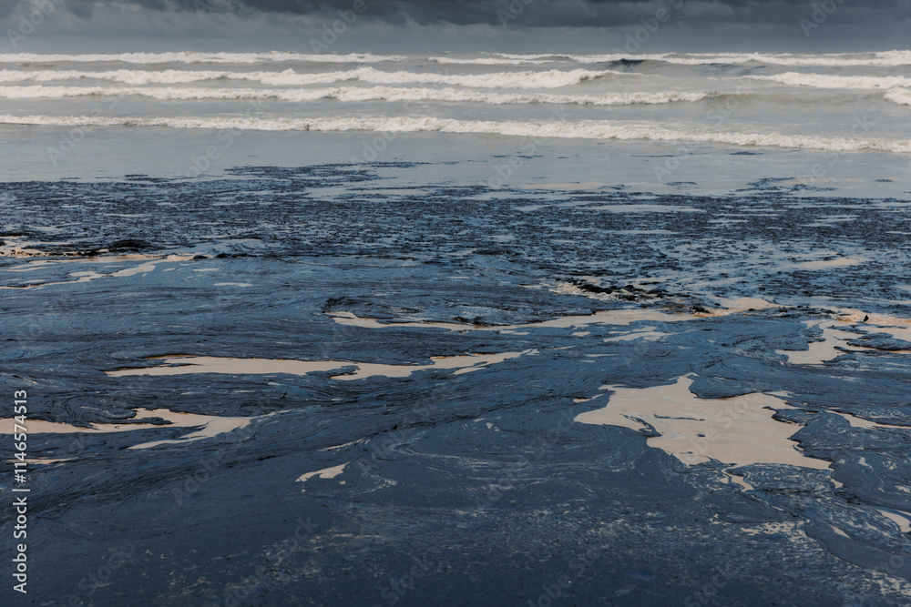 Oil leak in sea coastline after a tanker wreck. Oil fuel polluted and destroy beach Oil leak in sea coastline after a tanker wreck. Oil fuel polluted and destroy beach