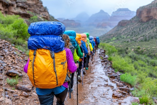 A group of outdoor enthusiasts treks along the picturesque paths of the Grand Canyon, highlighting the magnificence of its natural landscapes and rugged terrain. photo