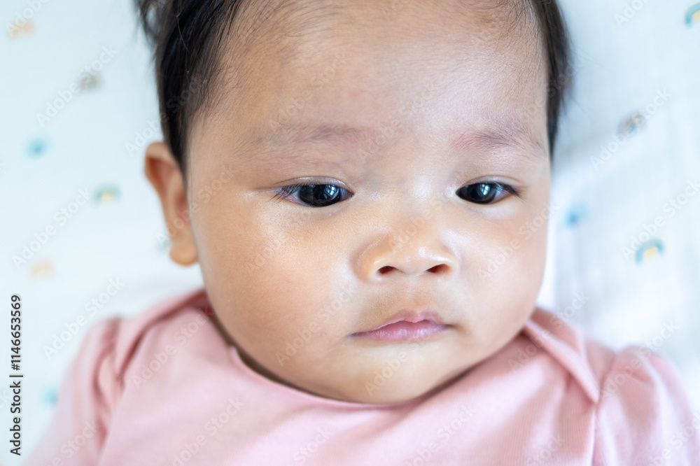 Newborn baby girl asian infant close-up portrait soft lighting gentle look for family memories Newborn baby girl asian infant close-up portrait soft lighting gentle look for family memories