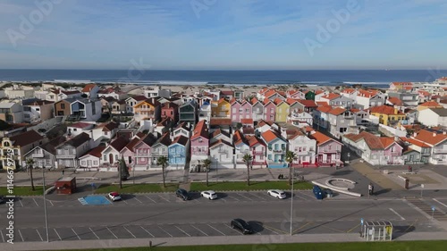 Aerial drone view of colourful houses along Costa Nova do Prado beach, Portugal