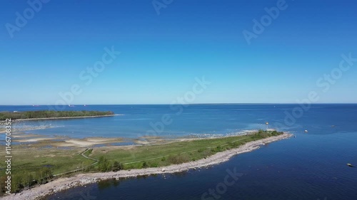 Wallpaper Mural Aerial footage of a coastal green field on a sunny day in Paljassaare peninsula, Tallinn, Estonia Torontodigital.ca