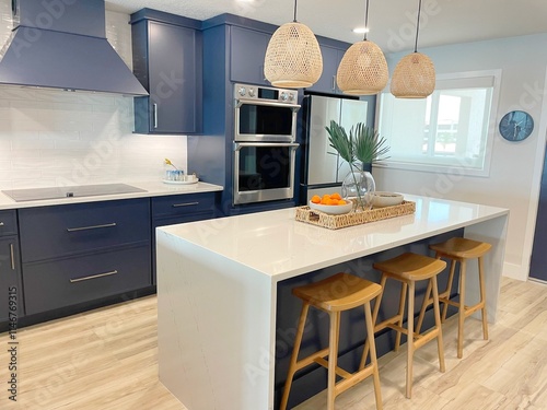 Wallpaper Mural Newly remodeled modern coastal condo kitchen designed with blue cabinets, white countertops, and beachy oak wood accents.  Torontodigital.ca