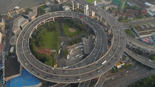 SHANGHAI, CHINA - NOVEMBER 7, 2024 aerial view of traffic and urban landscape showcasing roadways and green spaces in bustling Shanghai