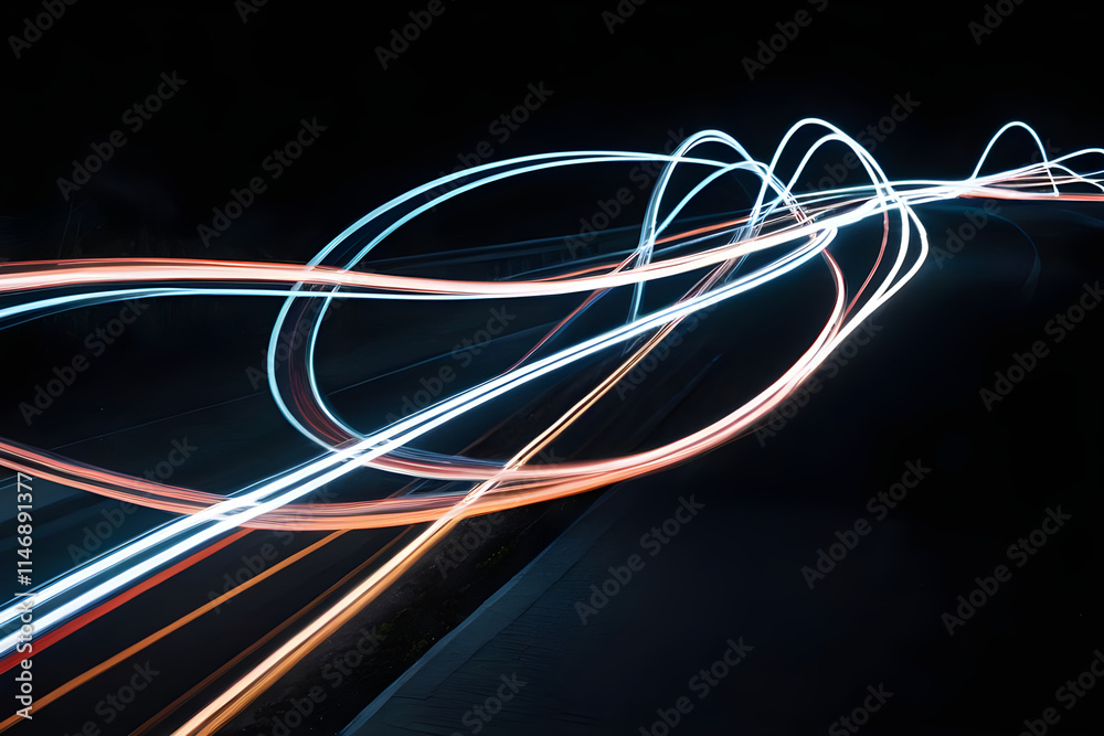 Light trails illuminating the night road creating a futuristic atmosphere Light trails illuminating the night road creating a futuristic atmosphere