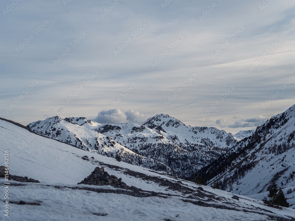 Snowy alpine valley with distant peaks Snowy alpine valley with distant peaks