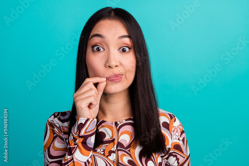 Photo of pretty young woman fingers tie mute mouth lips wear top isolated on teal color background photo