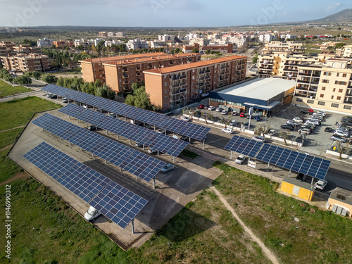 Drone photo of solar panels above a parking lot in Italy for renewable energy