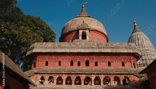 An artistic angle of Kamakhya Temple, capturing the majestic dome against a clear blue sky photo