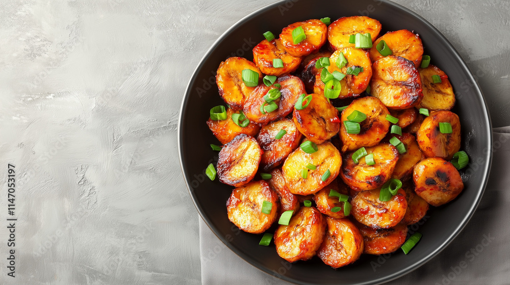 Roasted plantains in sticky sweet chili sauce with green onions
Roasted plantains in sticky sweet chili sauce with green onions