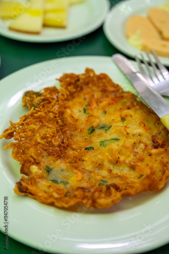 Traditional Andalusian dish from potato and seafood, Tortillitas de Camarones, Shrimp Fritters served in old tavern as tapas, Sanlucar de Barrameda, Spain photo