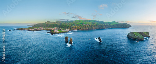 Aerial view on the west side of the isle of Sao Miguel with the village of Mosteiros at sunset, Azores Portugal