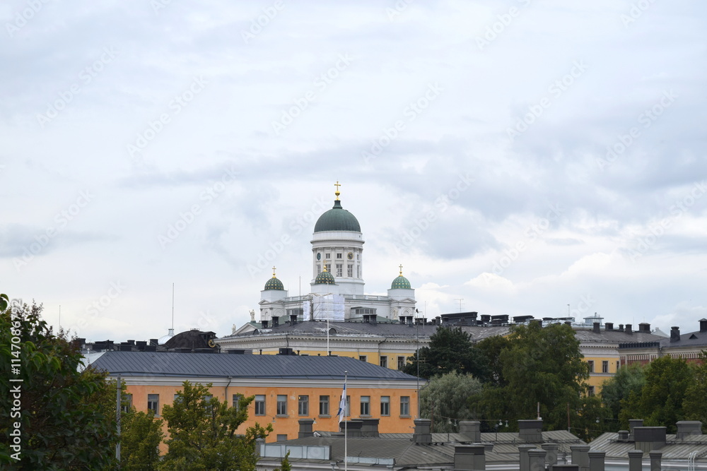 Fototapeta premium View to the Helsinki Cathedral above cityscape and roofs