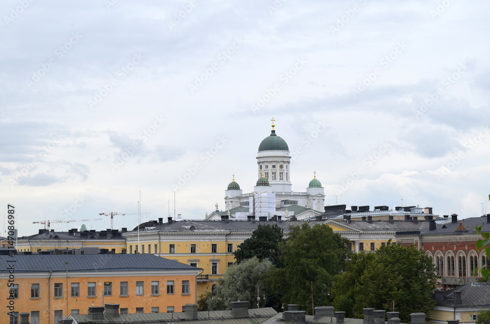 Fototapeta premium View to the Helsinki Cathedral above cityscape and roofs