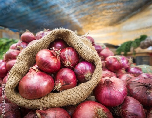 Red Onions in Burlap Sacks Ready for Sale at the Local Market