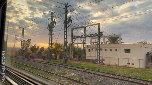 Sunset view from the window of the a Train in Morocco