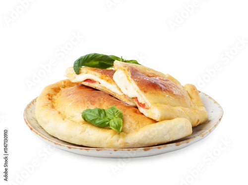 Pieces of delicious calzone pizza with mozzarella, tomatoes and basil isolated on white