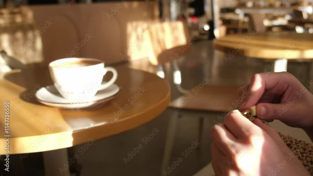 A slow-motion close-up video capturing the intricate movements of a woman’s hands as she knits, showcasing delicate craftsmanship and focus A slow-motion close-up video capturing the intricate movements of a woman’s hands as she knits, showcasing delicate craftsmanship and focus