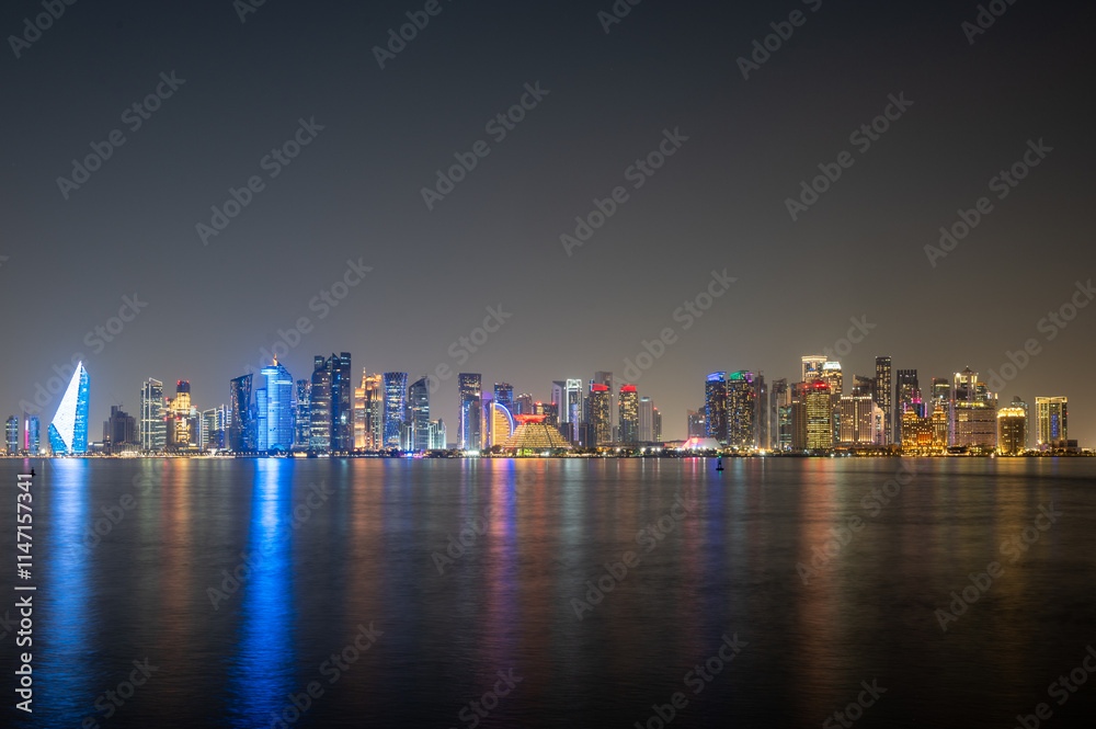 Obraz premium Doha city skyline illuminated at night. Qatar, Middle East