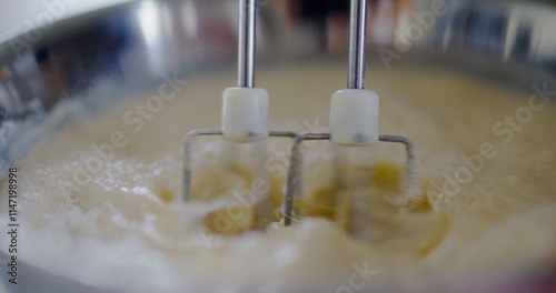 Close-Up of Mixer Mixing Pancake Batter in Bowl