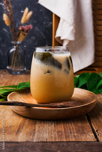 a glass of grass jelly ice, a popular drink during Ramadan