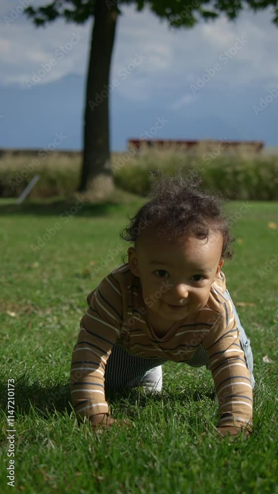 A playful toddler is joyfully enjoying the beauty of nature while exploring in a park A playful toddler is joyfully enjoying the beauty of nature while exploring in a park