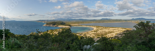 Panorama of idyllic voidokilia beach with turquoise colored water from a high point of view on a sunny spring day, Messinia, Peloponnese, Greece