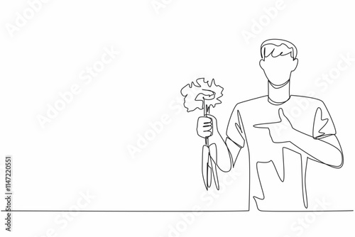 Single one line drawing man holding some carrots with the tips of the leaves still thick. Plays role in bone health. Carbohydrate. International Carrot Day. Continuous line design graphic illustration