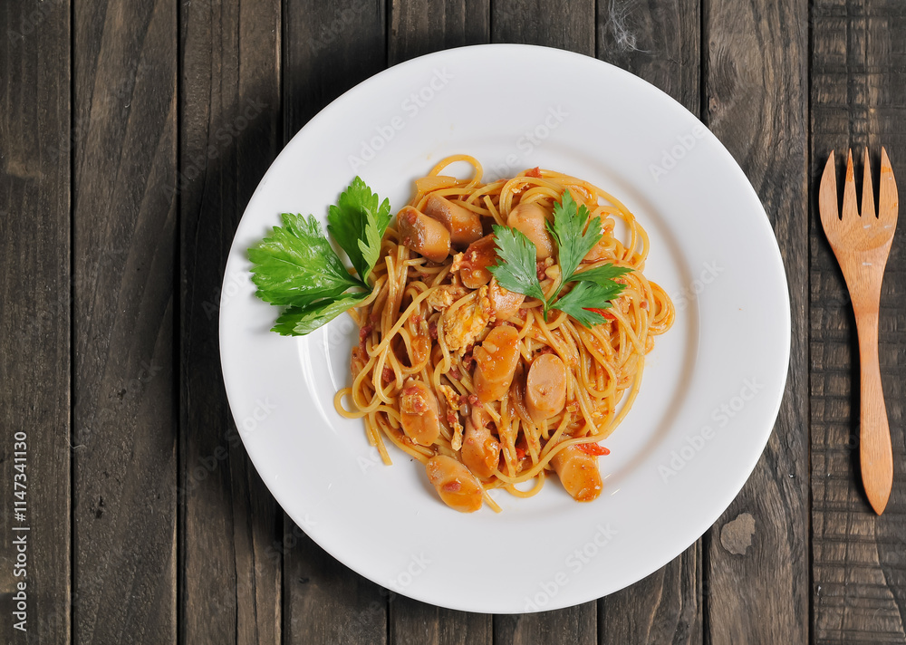 Fried spaghetti served on a white plate Fried spaghetti served on a white plate