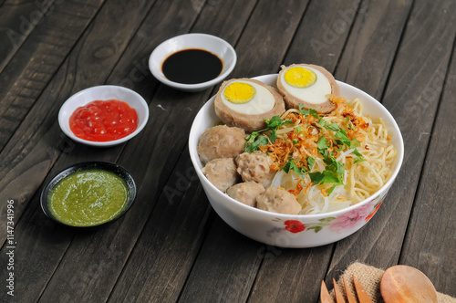 Meatballs are a processed meat dish made from ground meat, flour and spices, then formed into balls and boiled. Meatballs are Tio's specialty food