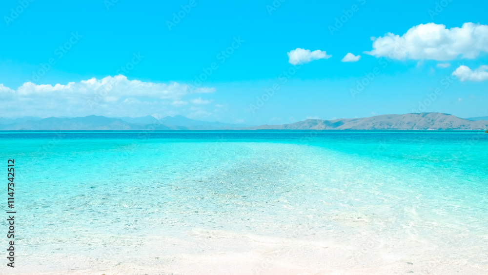 Beautiful tropical beach with white sand and blue sky. summer background and summer vacation concept Beautiful tropical beach with white sand and blue sky. summer background and summer vacation concept